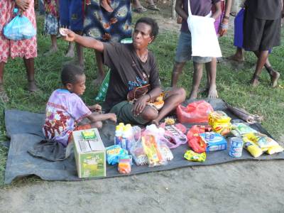 Woman selling in an informal market in Wewak, East Sepik Province, PNG, 2014